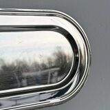 Small antique tray made of lightweight metal.