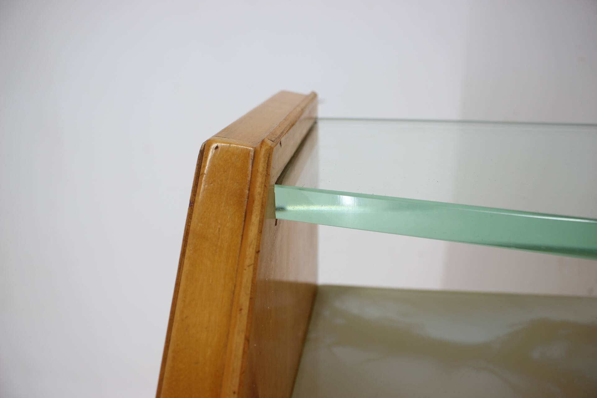 1960s italian sideboard/chest of drawers in high gloss finish with glass top and shelf