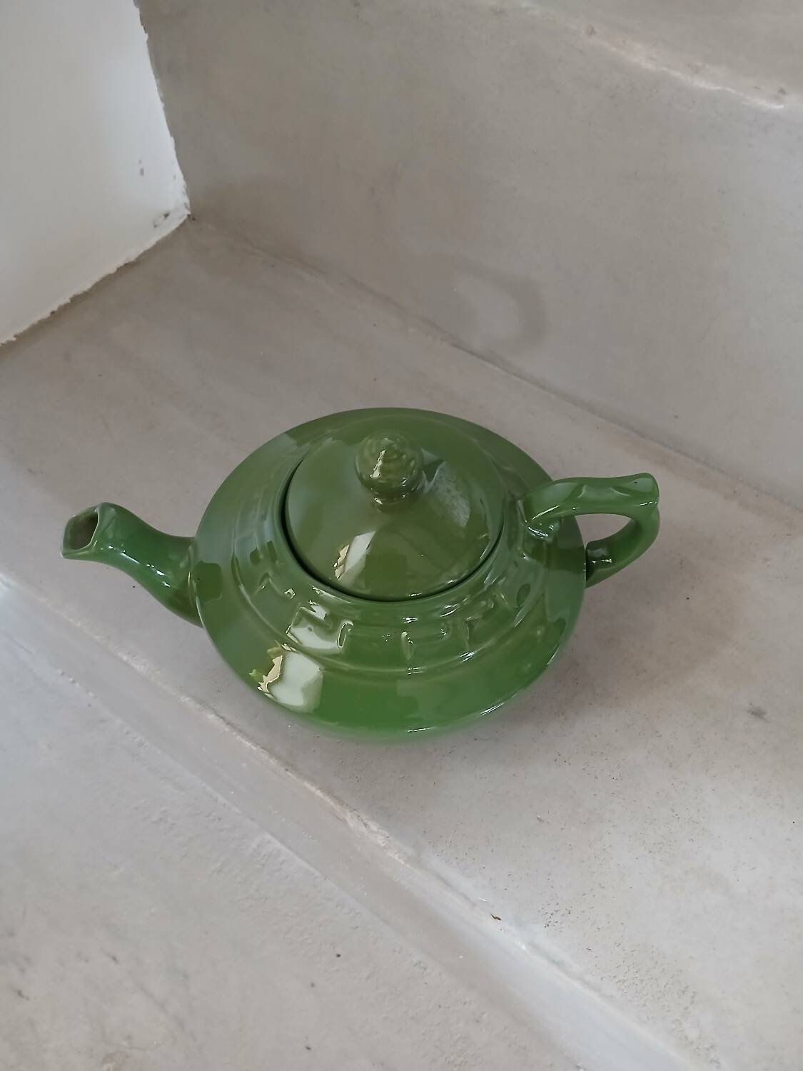Green earthenware teapot
