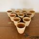 Lot de 10 pots en terre cuite circa 1930 graineterie