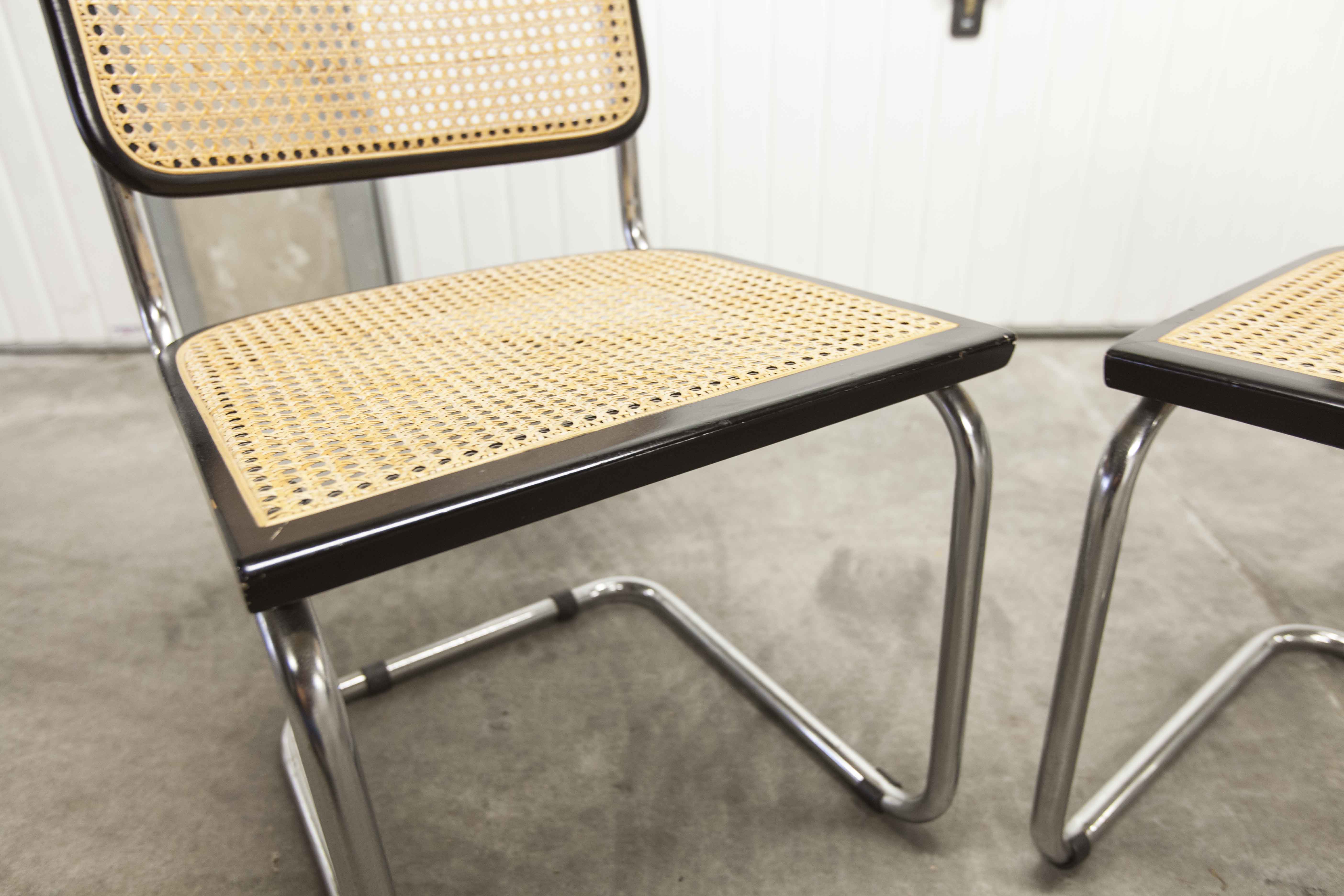 Pair of black Breuer b32 chairs and cannage