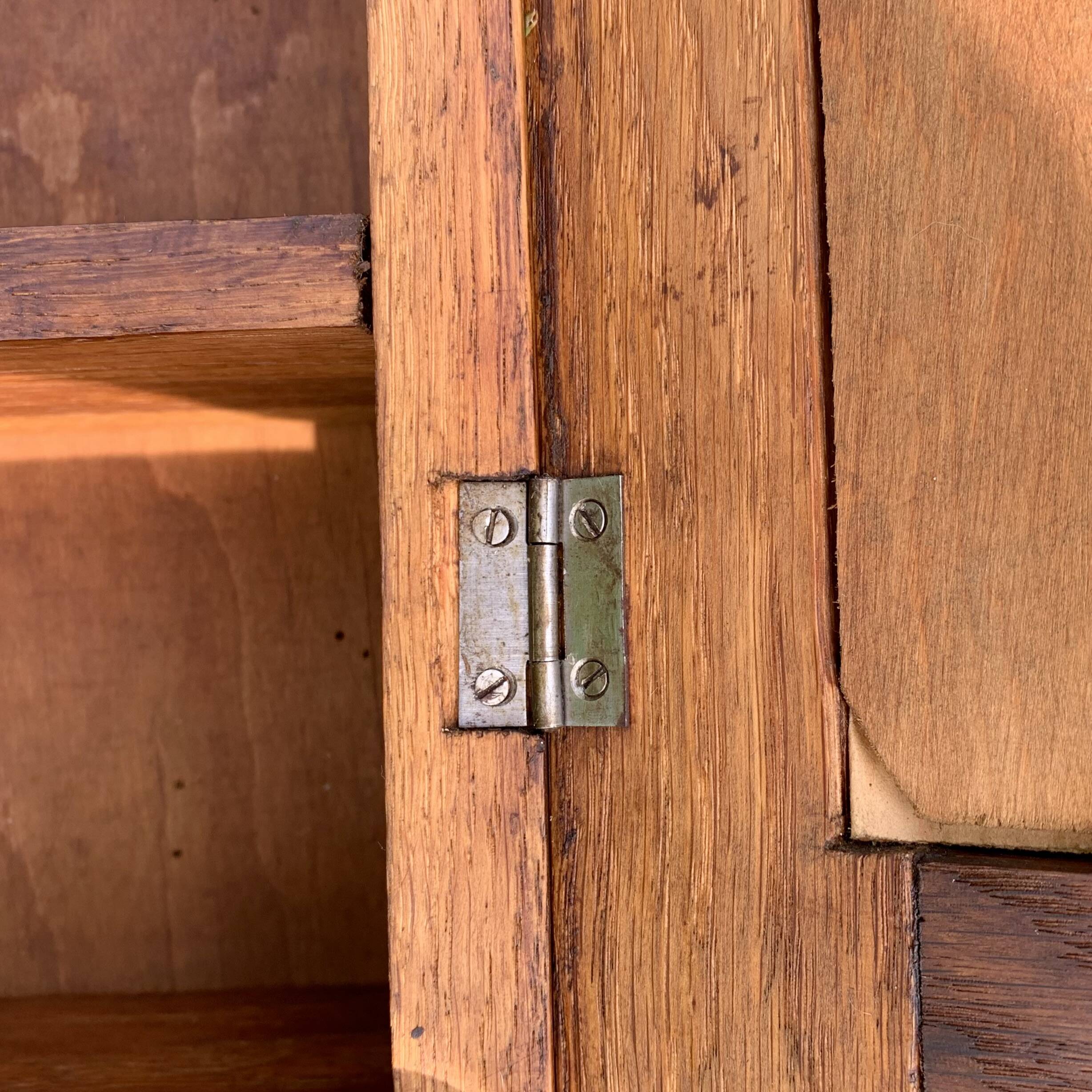 Old carved wooden medicine cabinet with beveled mirror