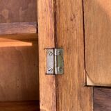 Old carved wooden medicine cabinet with beveled mirror