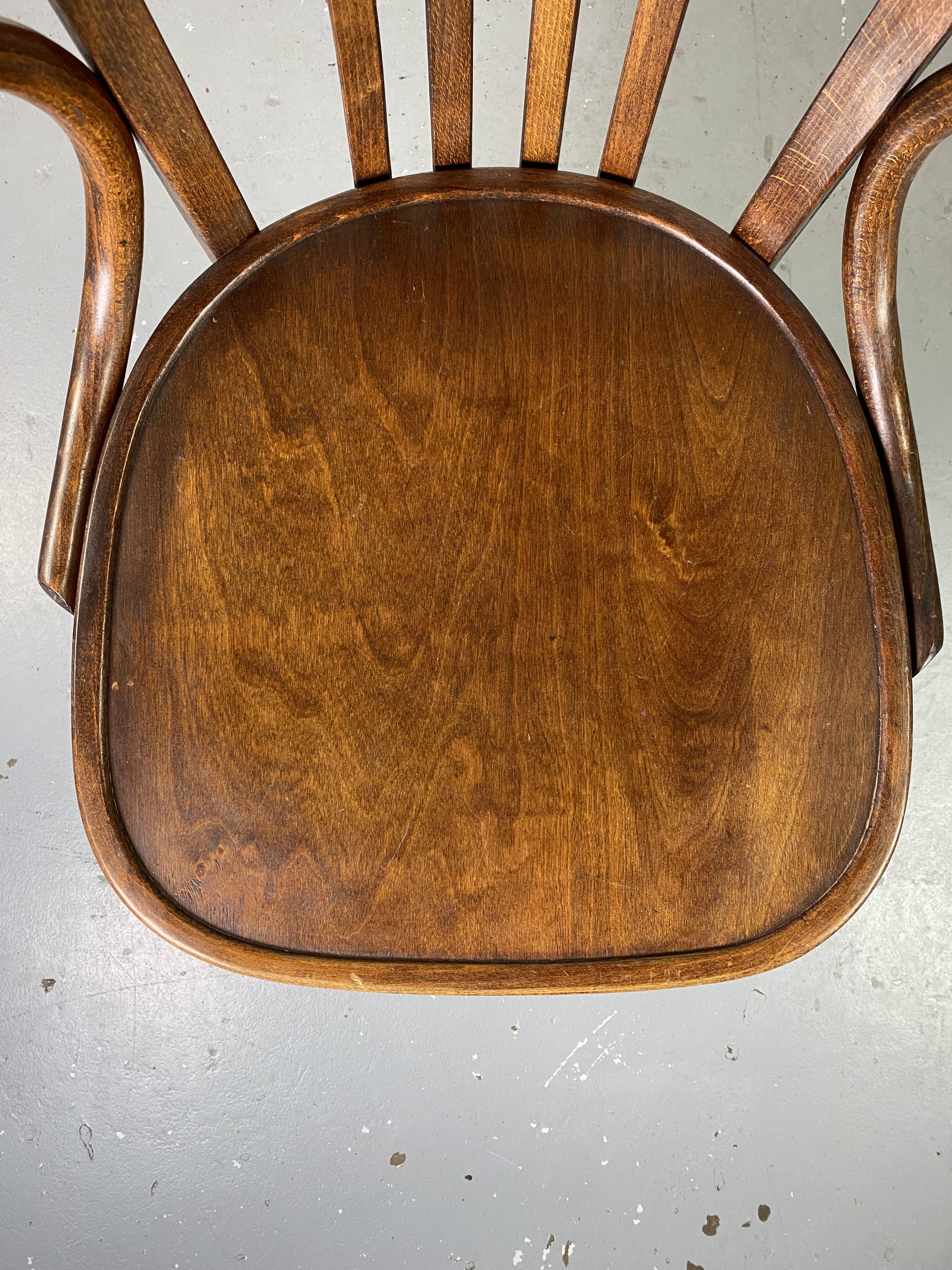 Baumann rotating wooden armchair