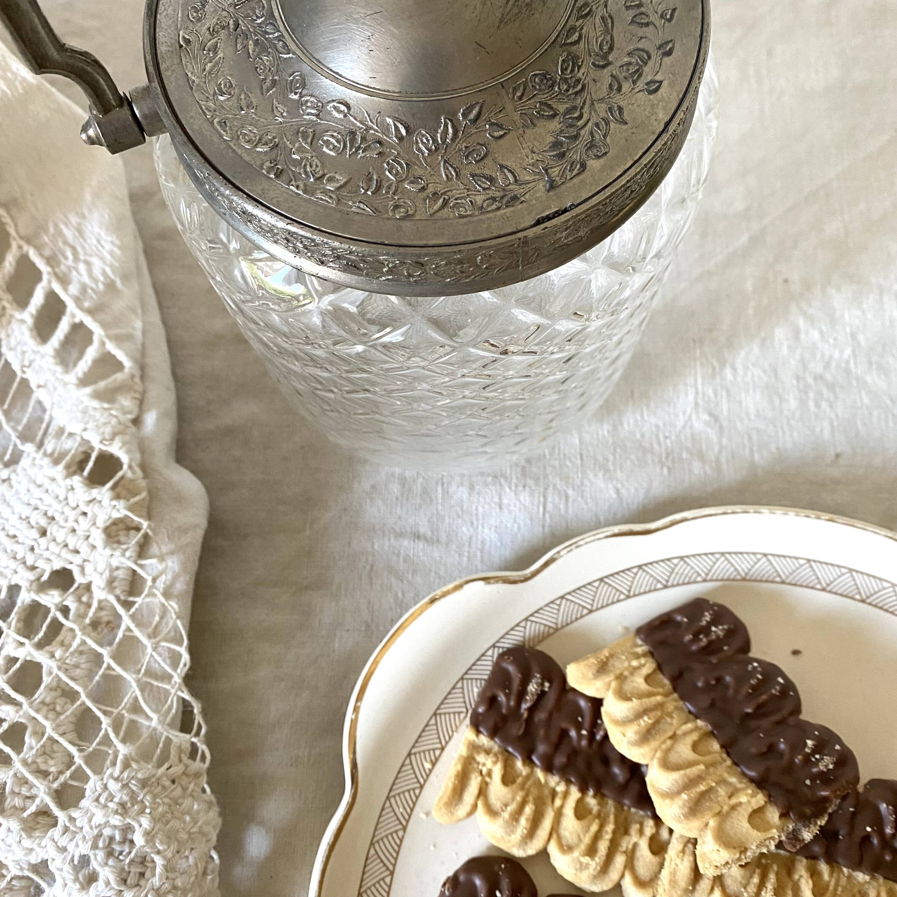 Old biscuit bucket in glass and metal