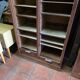 Antique double curtain cabinet in oak