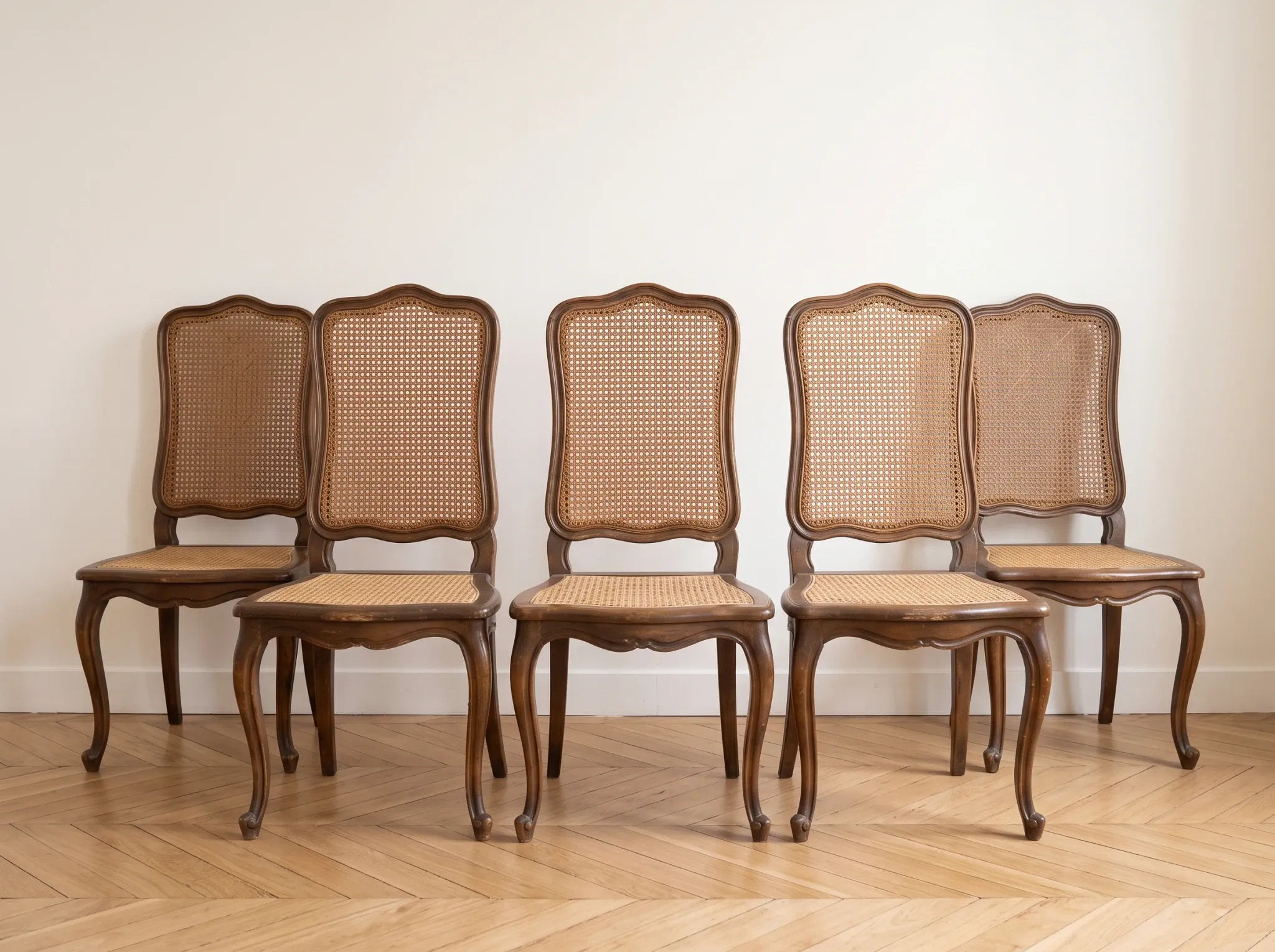 Set of 5 vintage caned chairs in classic style.