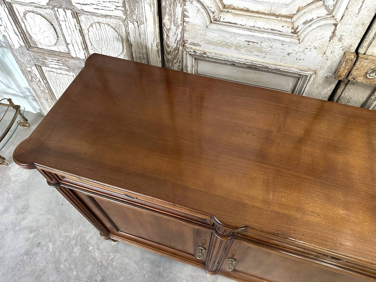 Louis XVI style enfilade in cherry wood, 20th century.