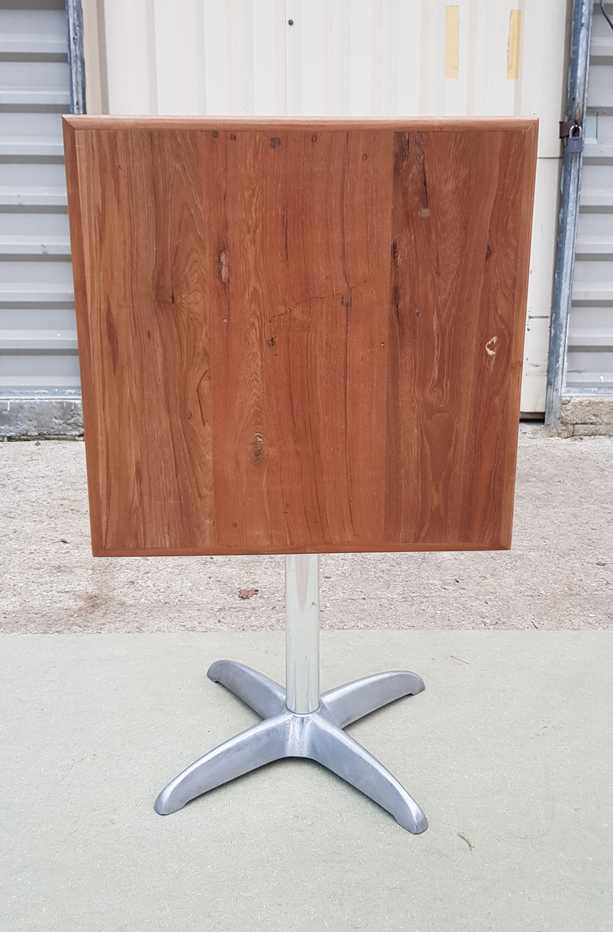 Foldable bistro table with teak top and aluminum base