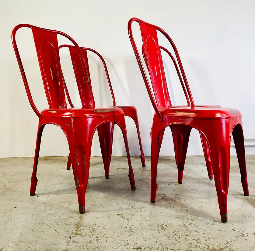 Set of four low chairs in red steel