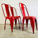 Set of four low chairs in red steel