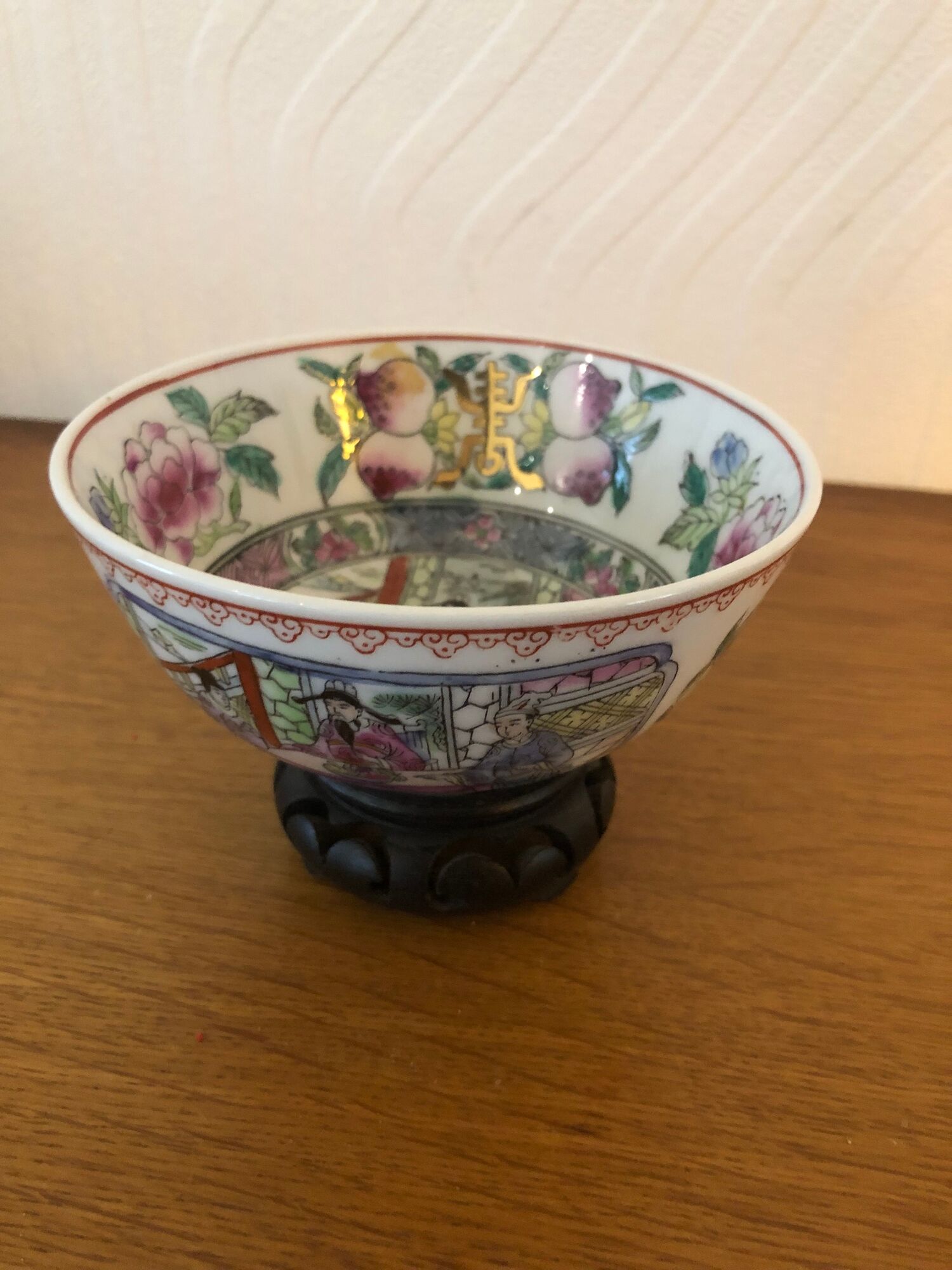 Chinese porcelain bowl on wooden base