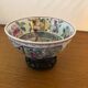 Chinese porcelain bowl on wooden base