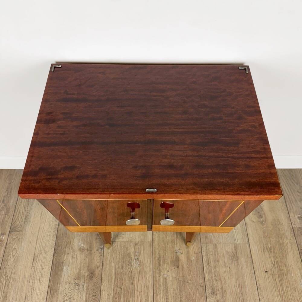 1950s bedside table in varnished wood veneer and brass.