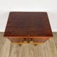 1950s bedside table in varnished wood veneer and brass.