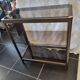 Vintage smoked glass console design
