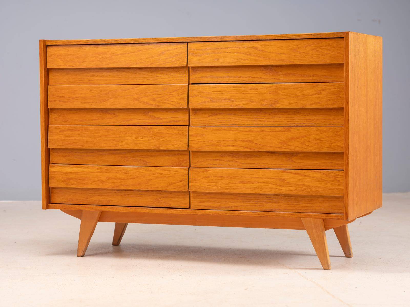Vintage Czech chest of drawers U-453 by Jiří Jiroutek, 1960s, oak veneer, 110 × 45 × 77 cm