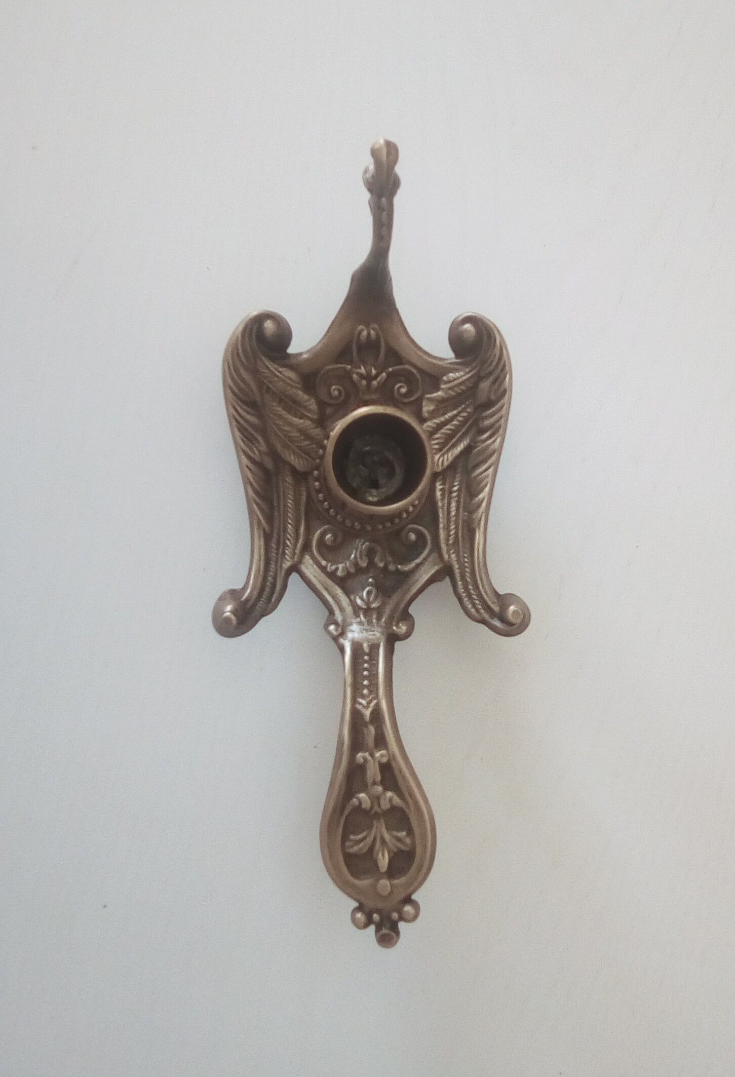 Old hand candlestick in chissed solid brass