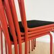 Lot de 4 chaises empilables en métal rouge et noir des années 1970 : Chaise de salle à manger Space Age