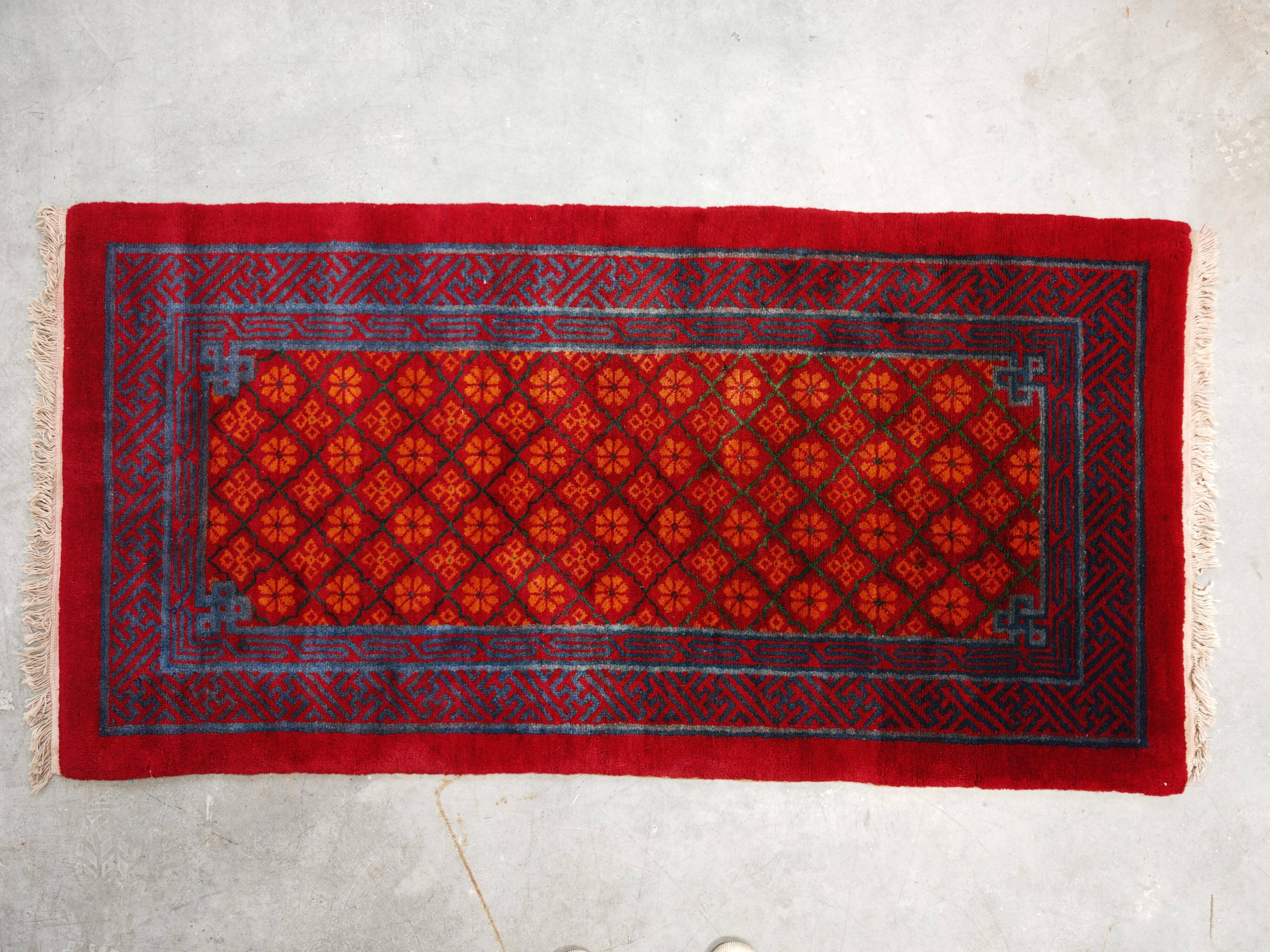 Ancient Khotan carpet, hand-knotted, floral pattern, Turkestan, 1960s.