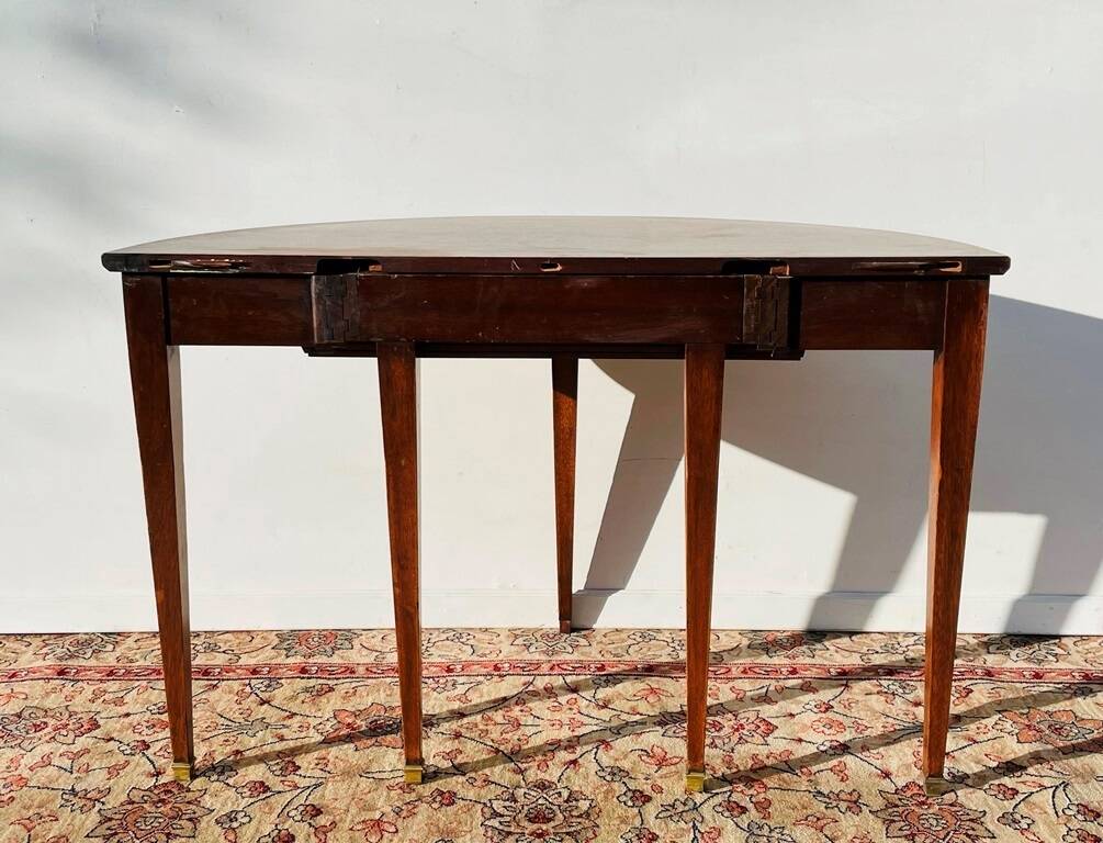 Empire-style demi-lune console from the 19th century.