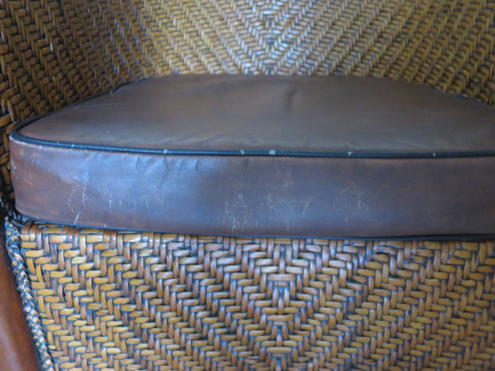 Woven rattan armchair and exotic wood in colonial style, 1980s.