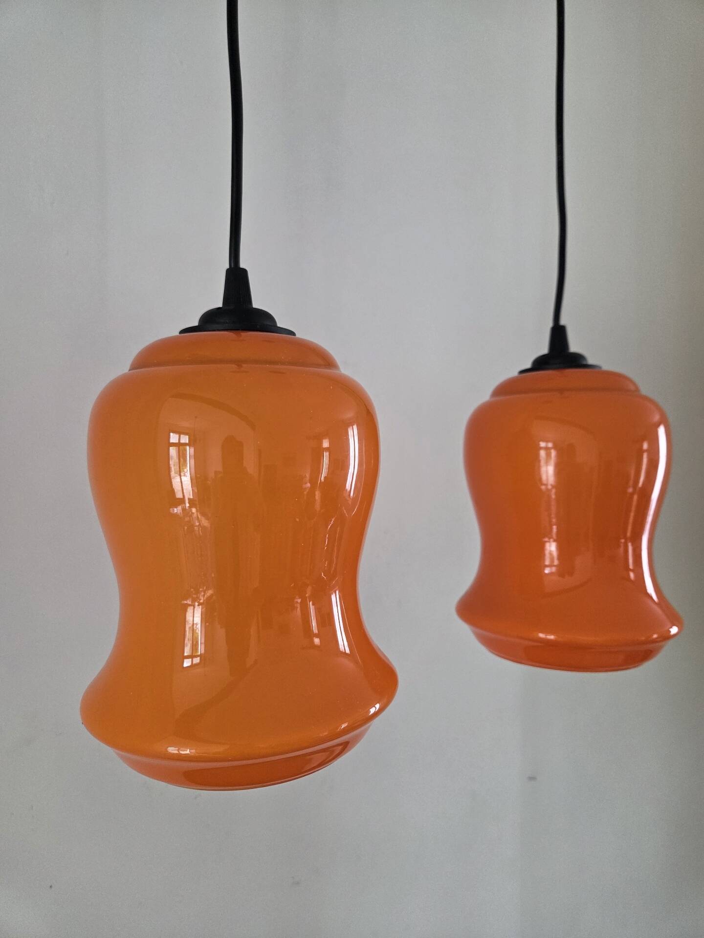 Pair of orange Opaline pendant lights, 1970s