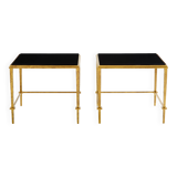 Pair of side tables in gilded iron and black lacquer Maison Ramsay 1950