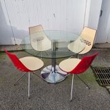 Guzzini dining set, round glass table and 4 shell chairs.