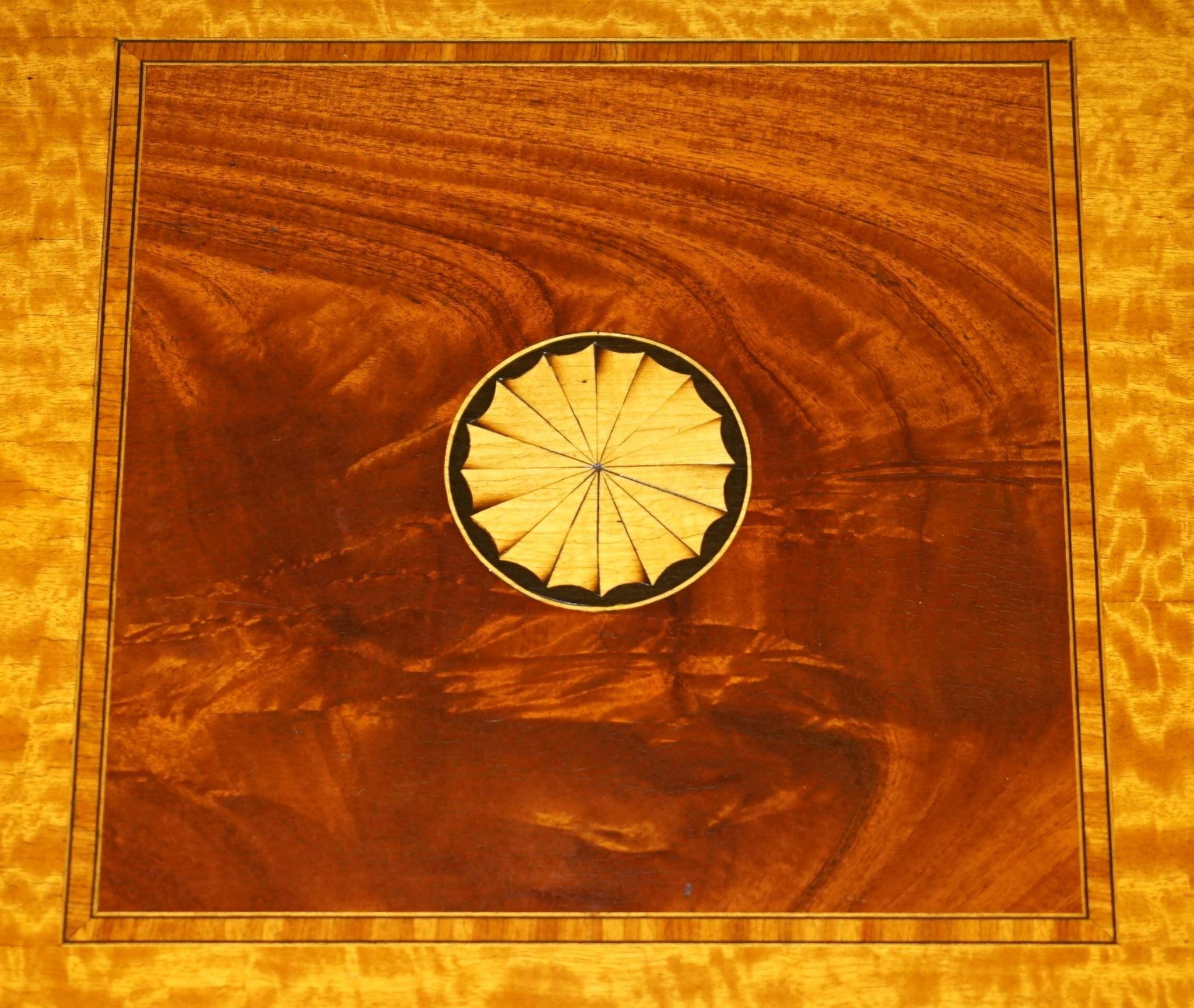 Sheraton Revival rotating library table in walnut and satin wood.
