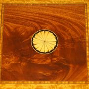 Sheraton Revival rotating library table in walnut and satin wood.