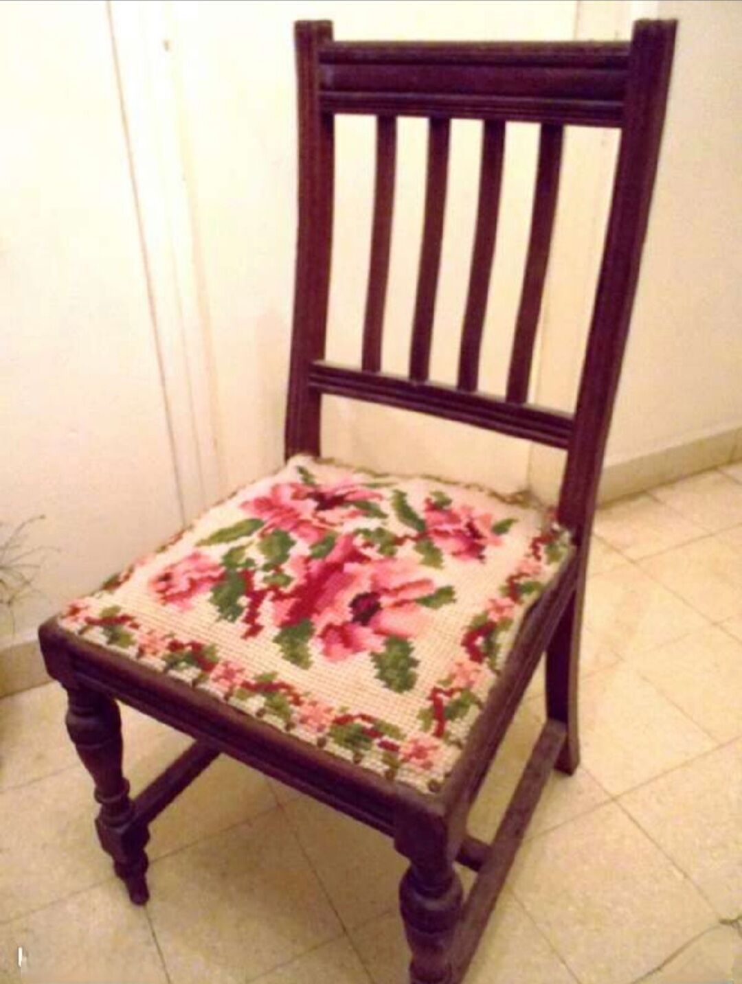 Wooden chair with embroidered seat