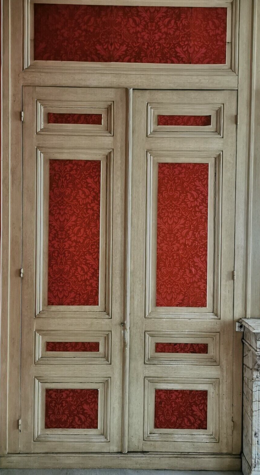 Closet front with double molded doors in patinated wood XX century
