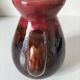 Vintage pitcher in raspberry red and chocolate flamed ceramic.
