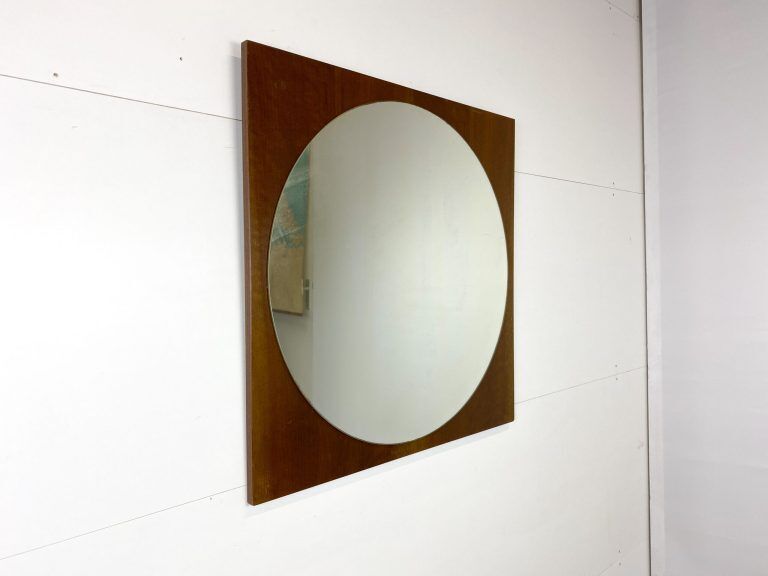 Retro mirror on wood