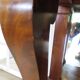 Empire/Restoration style console table with scrolled ends, mirrored back, and claw feet.