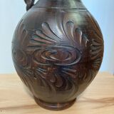 Scarified ceramic vase with twisted handle - African style