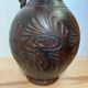 Scarified ceramic vase with twisted handle - African style