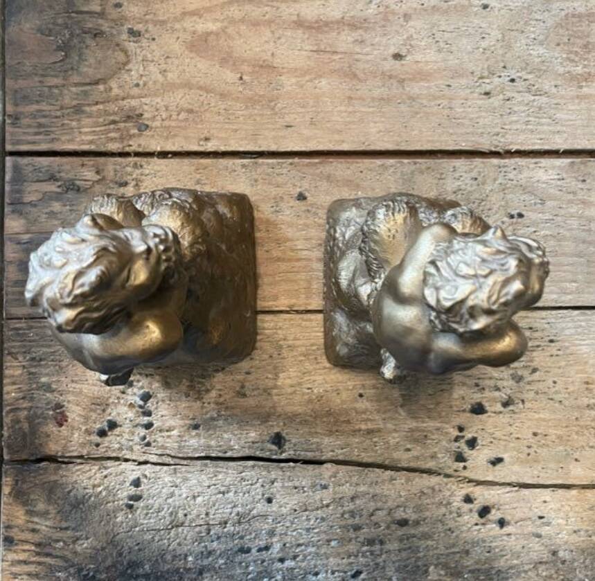 2 Seated satyr sculptures in cast bronze