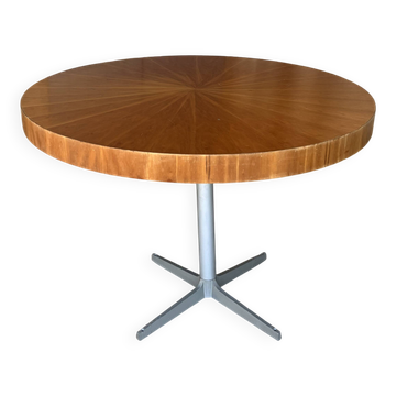 Vintage round table with a wooden top.