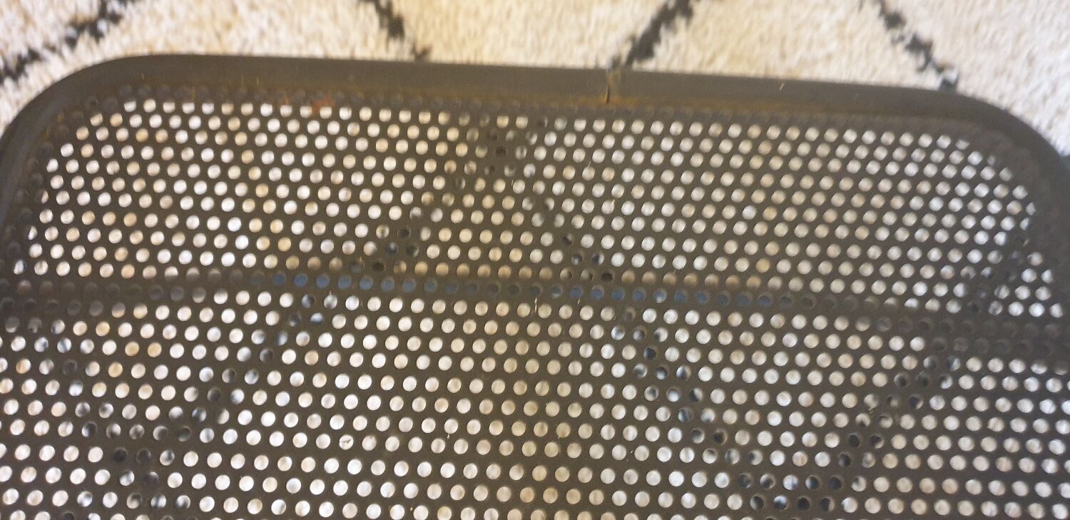 Pair of folding chairs in perforated metal