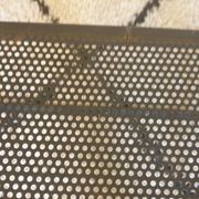 Pair of folding chairs in perforated metal