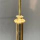 Baroque-style floor lamp in solid gilded bronze decorated with crystal pendants.