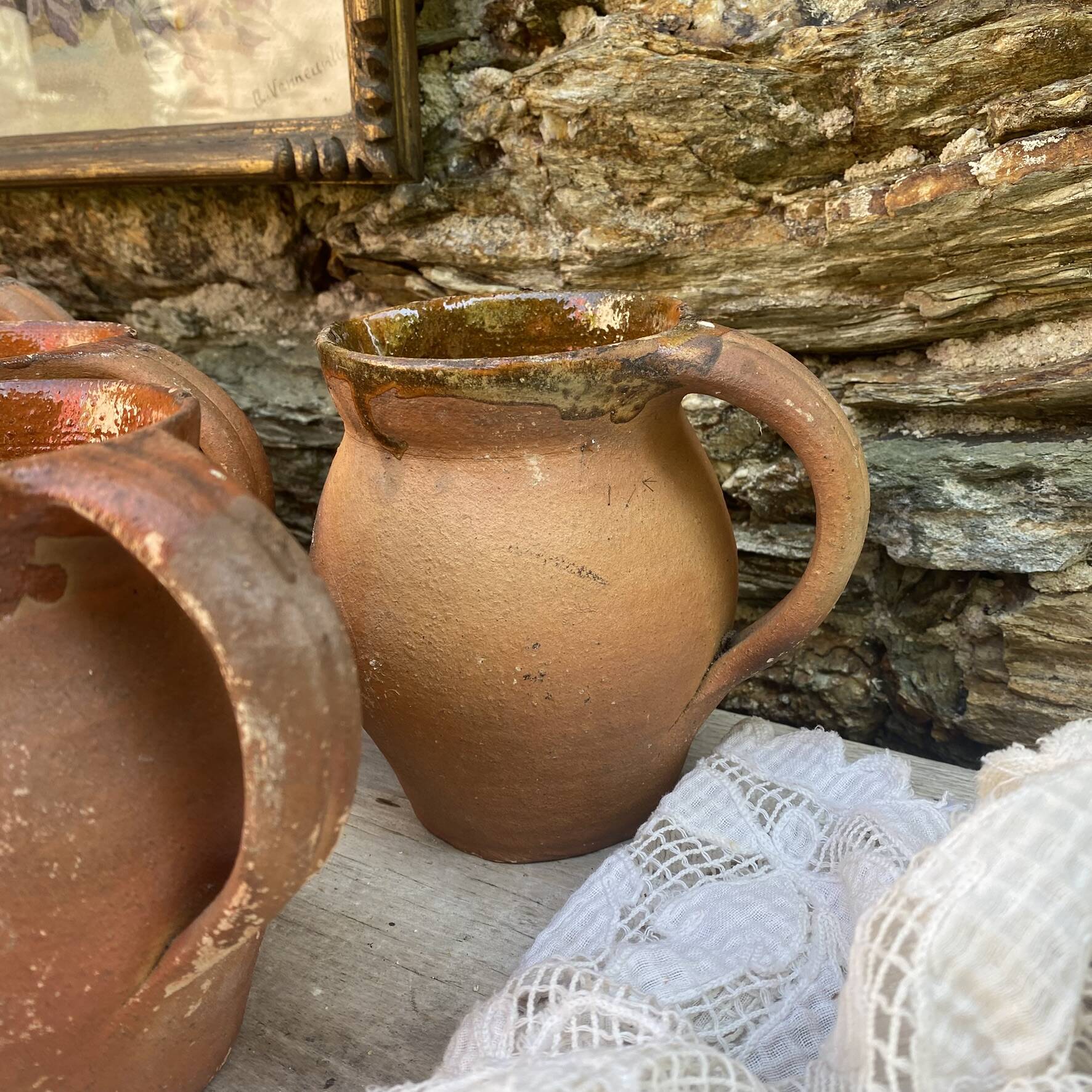 set of terracotta jugs country style