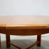 Vintage extendable round wooden dining table