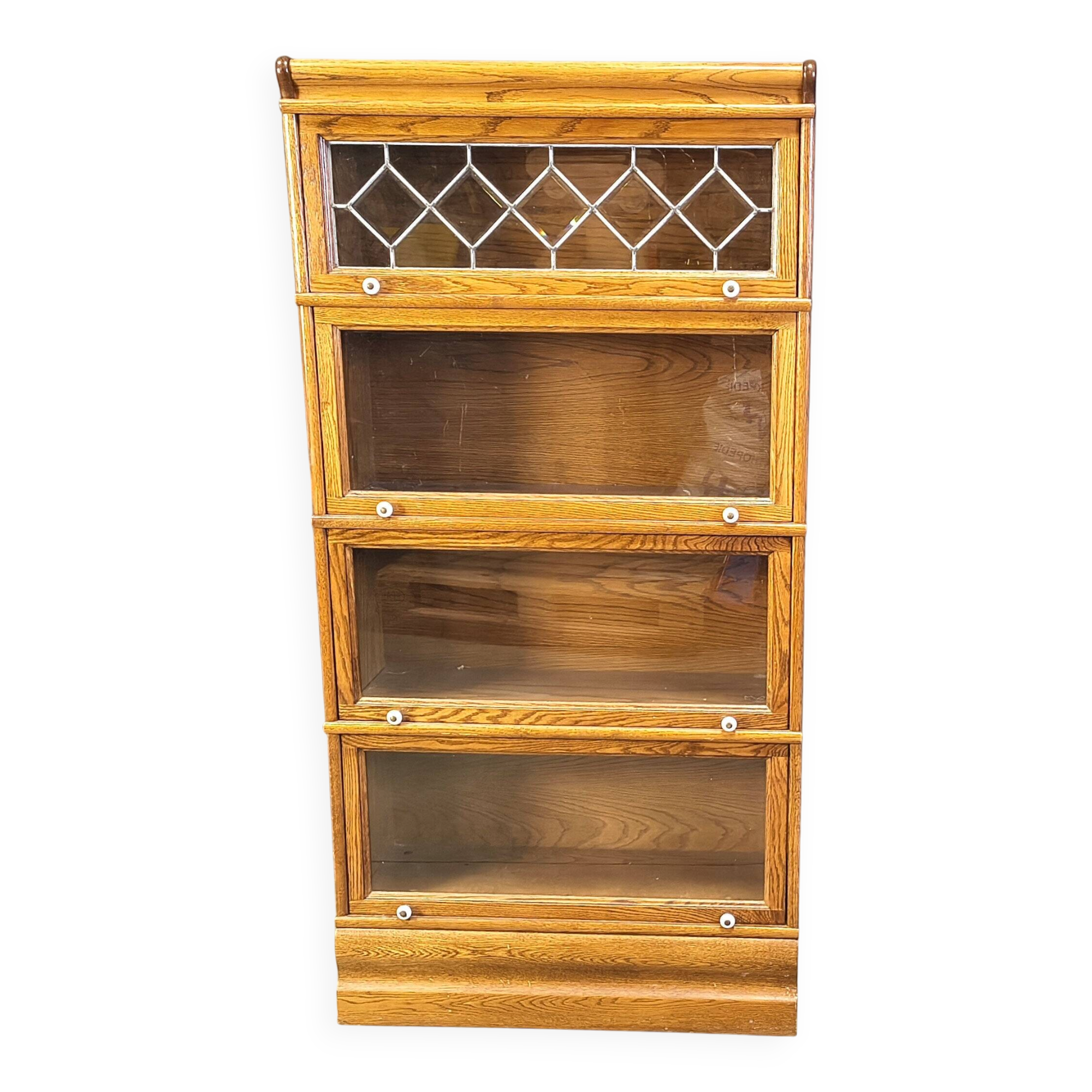 Four tier oak barrister style bookcase with leaded glass