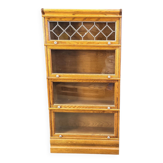 Four tier oak barrister style bookcase with leaded glass