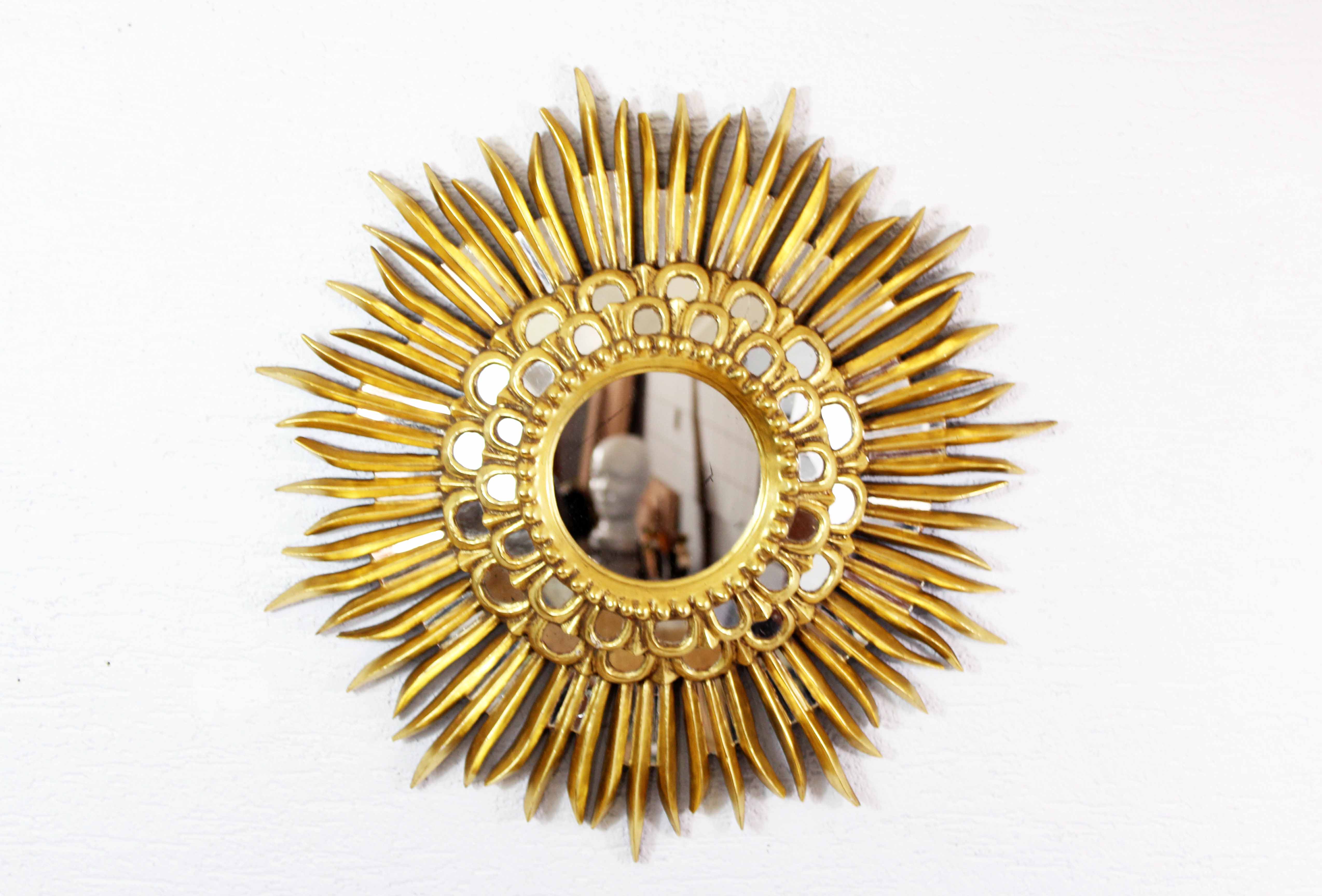 Sun mirror in wood and gilded stucco