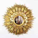 Sun mirror in wood and gilded stucco