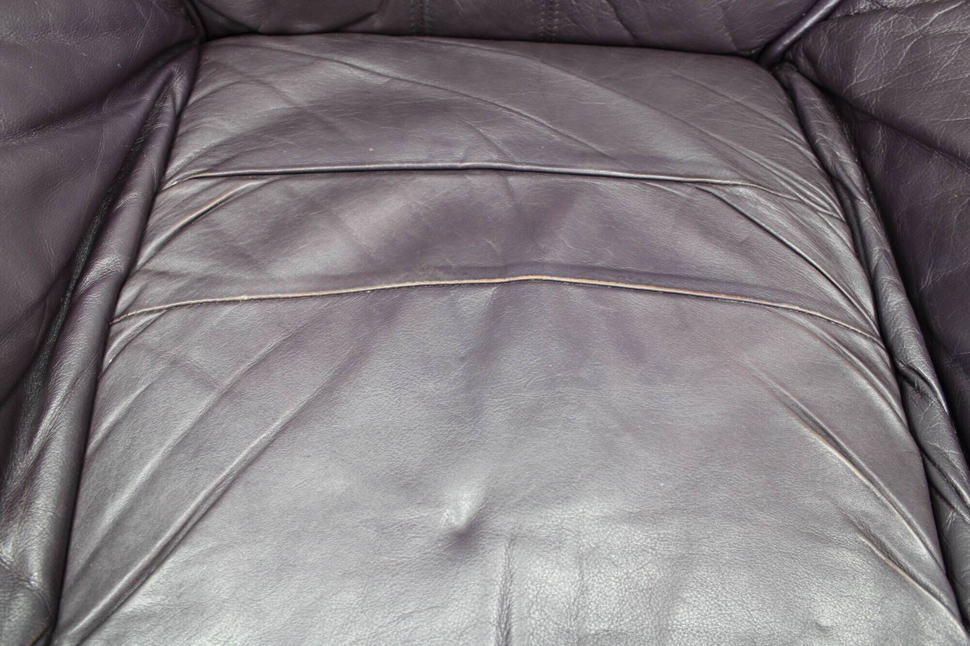Italian dark purple leather swivel lounge chair, 1980s